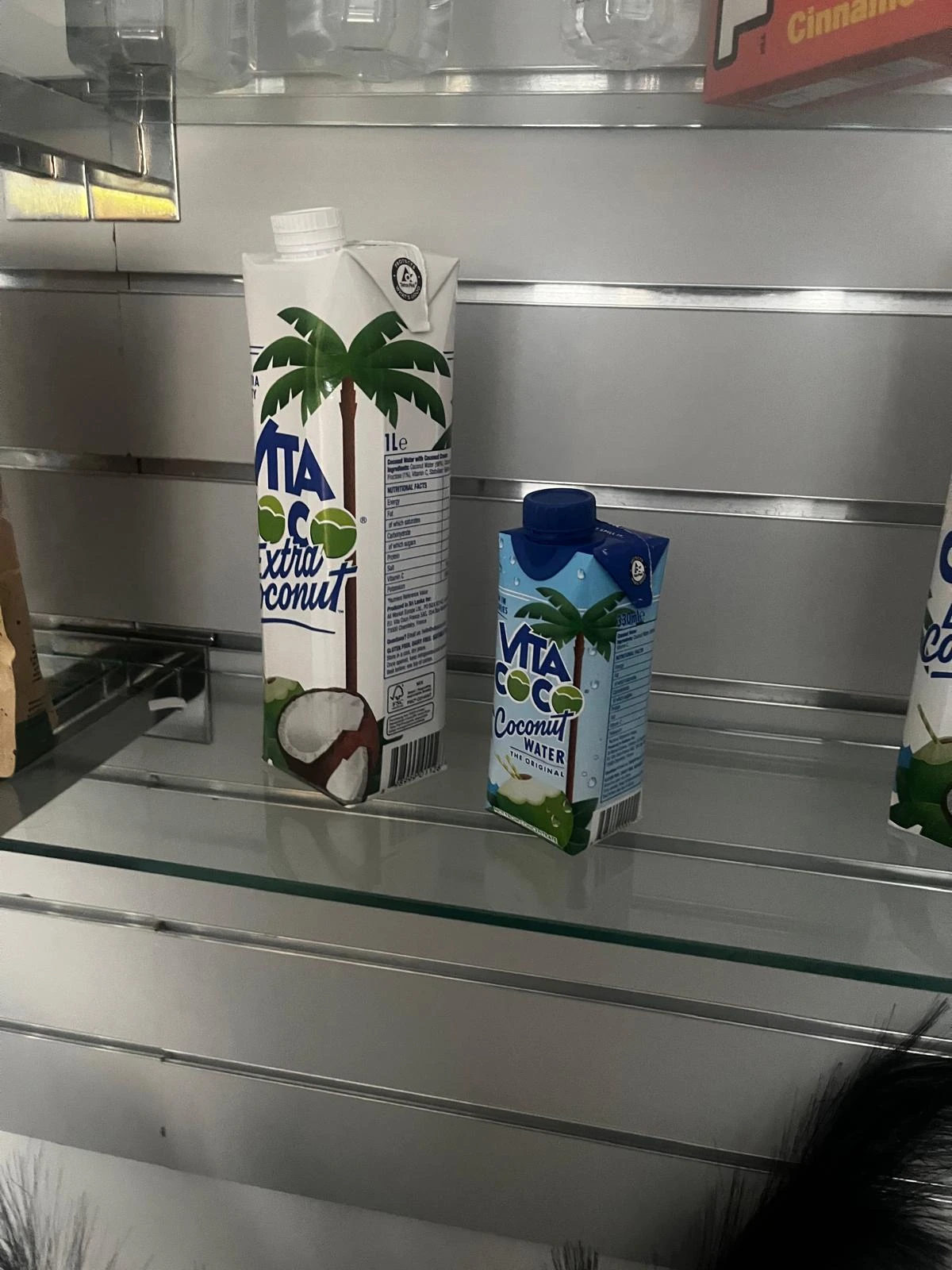 Vita Coco Extra Coconut and Original Coconut Water cartons on a shelf