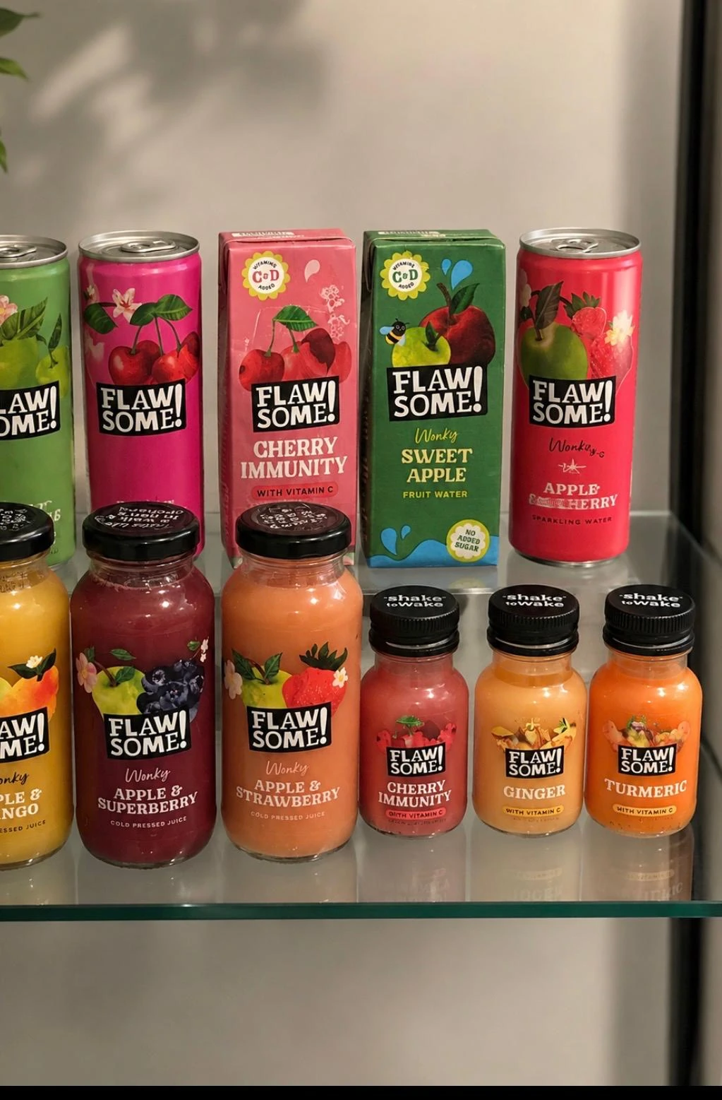 Flawsome fruit drinks and shots displayed on a shelf